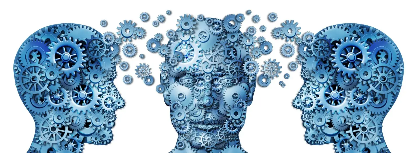Human head composed of interconnected blue gears symbolizing mechanical thinking.